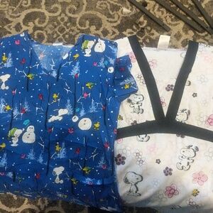 Lot of 2 Peanuts scrub tops size xs.
